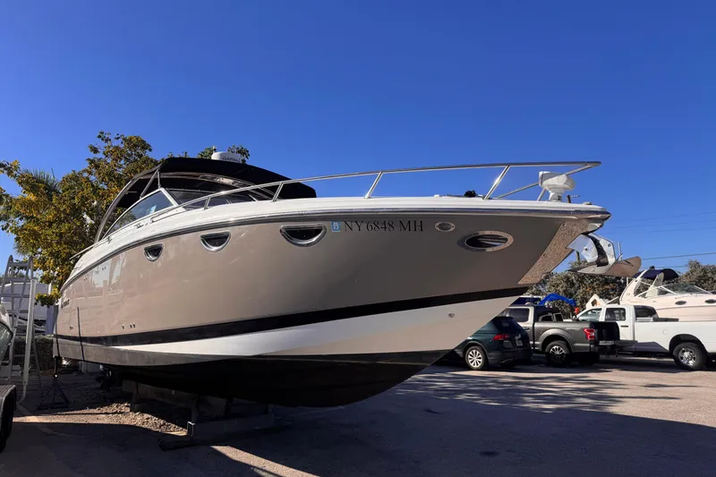 Slide: The Image of 2010 Cobalt 323 boat on display under clear blue sky. - 3