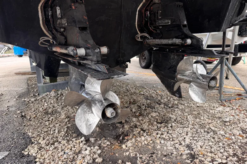 Slide: The Image of Dual propellers of a 2010 Cobalt 323 boat on gravel surface. - 4