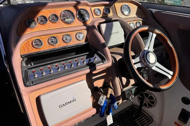 Slide: The Image of 2010 Cobalt 323 dashboard with gauges, Garmin GPS, and steering wheel. - 7