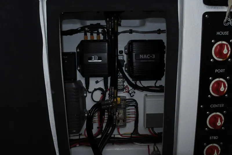 Slide: The Image of Electrical panel of a 2022 Conch 33 boat with wiring and control systems. - 10