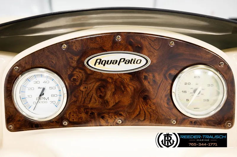 Slide: The Image of Dashboard of 2004 AquaPatio 220 RE boat with RPM and MPH gauges. - 32