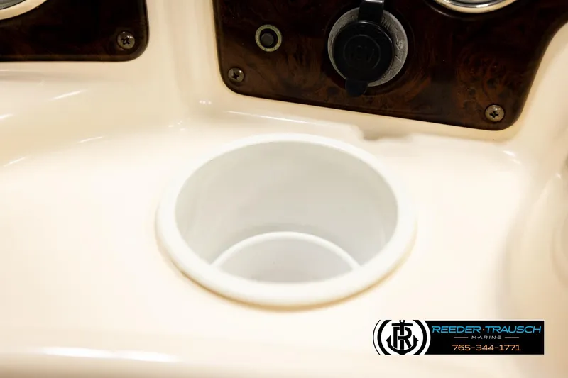 Slide: The Image of Cup holder and control panel on 2004 AquaPatio 220 RE boat. - 34