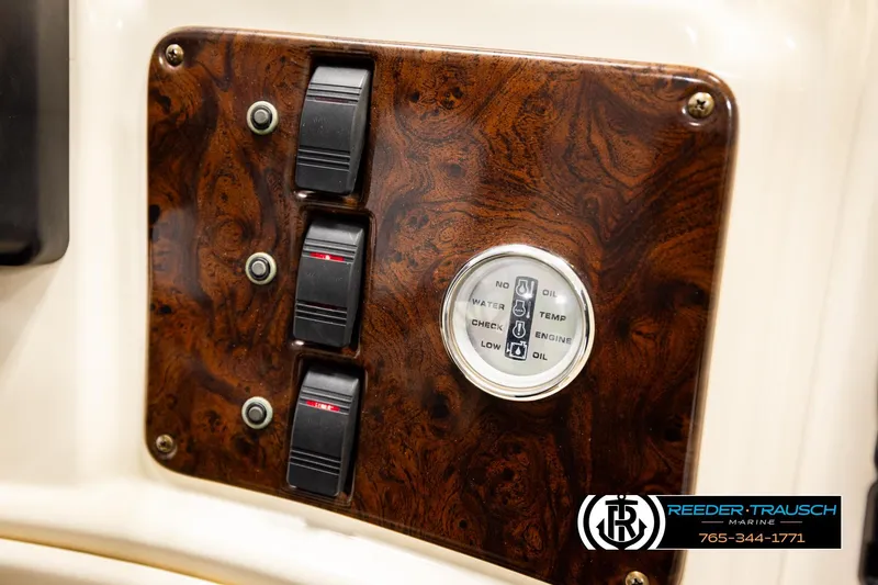 Slide: The Image of Control panel of 2004 AquaPatio 220 RE boat with switches and gauge. - 35