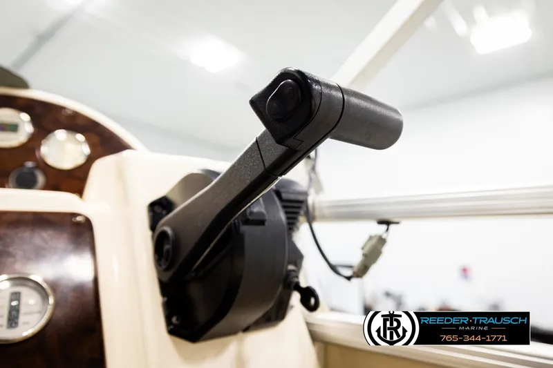Slide: The Image of Close-up of AquaPatio 220 RE 2004 boat throttle control in a marine setting. - 36