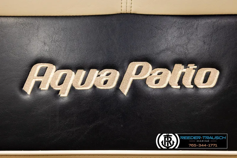 Slide: The Image of 2004 AquaPatio 220 RE logo on black leather with Reeder-Trausch Marine branding. - 39
