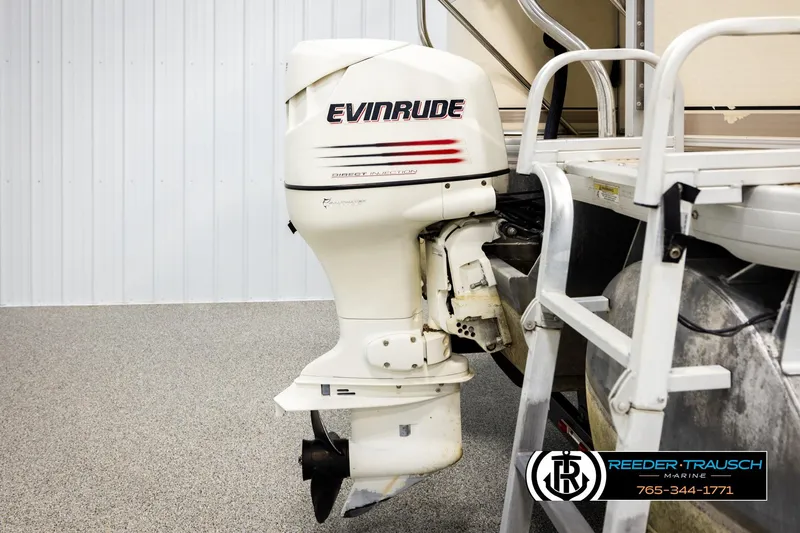 Slide: The Image of 2004 AquaPatio 220 RE with Evinrude outboard motor, displayed at Reeder-Trausch Marine. - 43