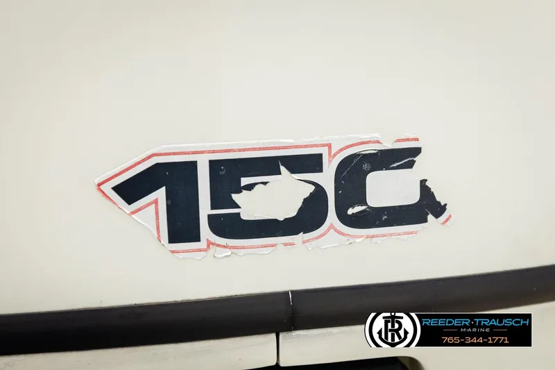 Slide: The Image of 2004 AquaPatio 220 RE boat with worn "150" decal and Reeder-Trausch Marine logo. - 45