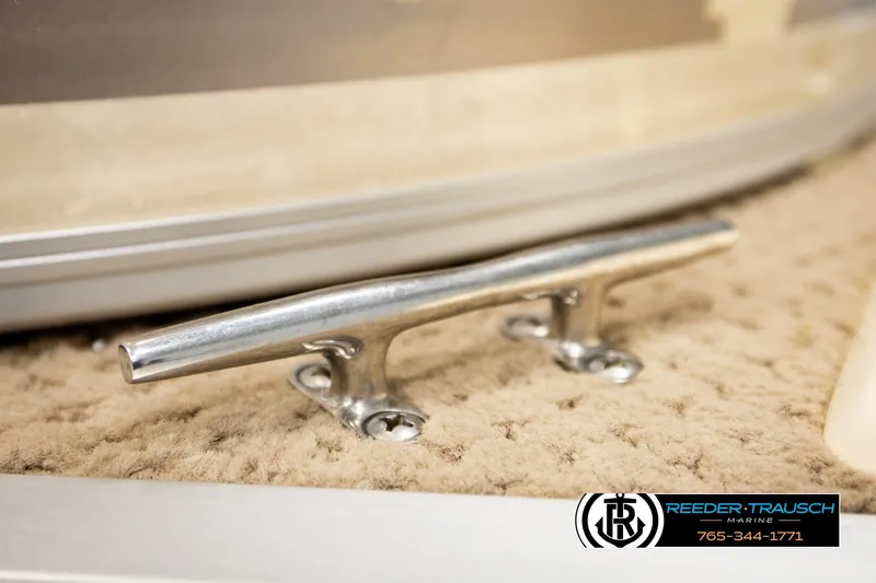 Slide: The Image of Stainless steel cleat on 2004 AquaPatio 220 RE boat, Reeder-Trausch Marine logo visible. - 50