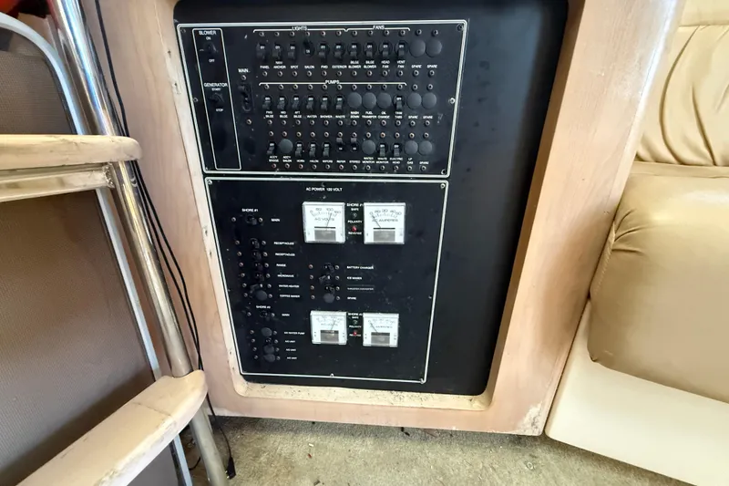 Slide: The Image of Control panel of a 2000 Carver 350 Mariner boat, featuring switches and meters. - 8