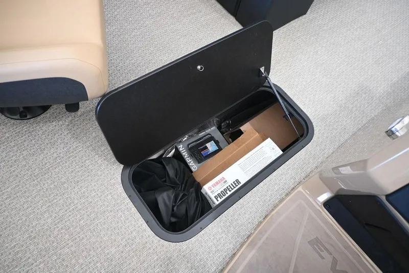 Slide: The Image of Storage compartment in 2026 Evotti 521CS boat with Yamaha propeller box and Garmin equipment. - 11