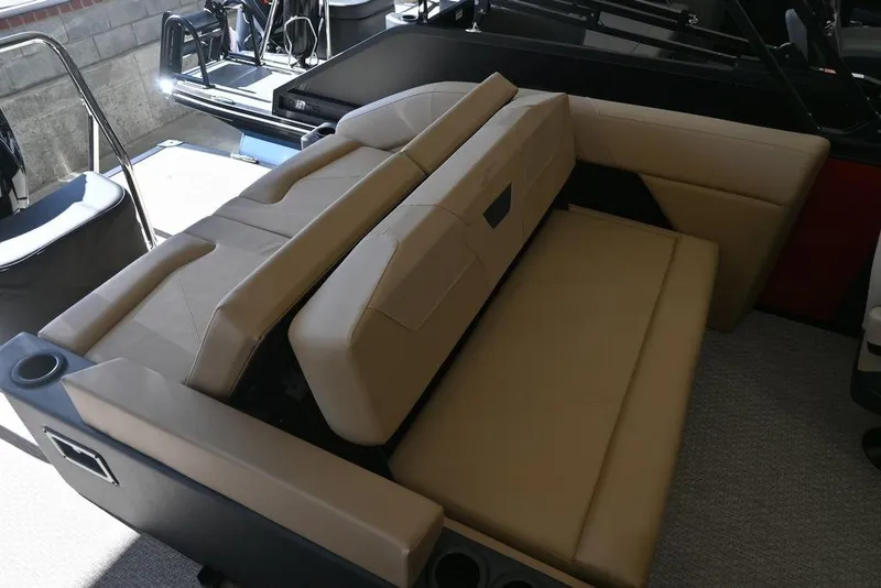 Slide: The Image of 2026 Evotti 521CS boat interior with beige seating and cup holders. - 15