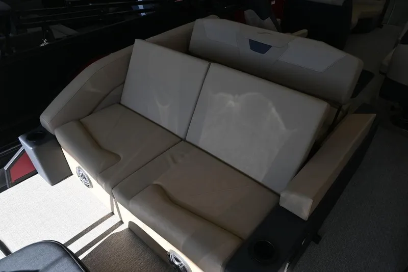 Slide: The Image of Luxurious seating in 2026 Evotti 521CS boat with beige upholstery and cup holders. - 17