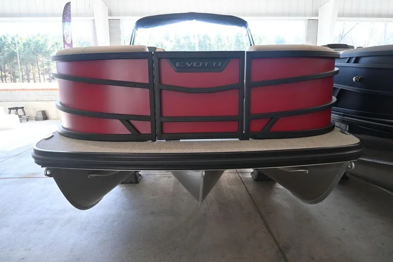 Slide: The Image of 2026 Evotti 521CS pontoon boat with red exterior in a showroom setting. - 5