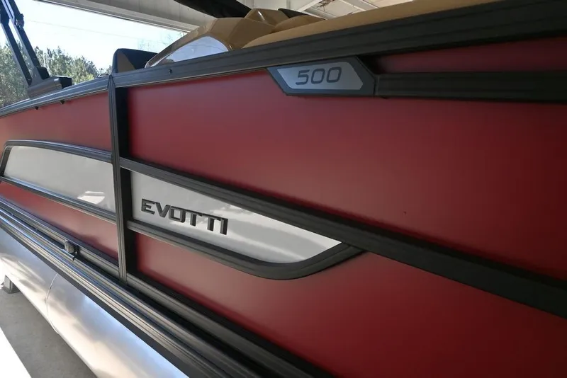 Slide: The Image of Red and white Evotti 521CS boat, model year 2026, with sleek design details. - 6