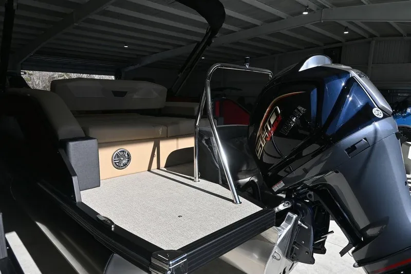 Slide: The Image of 2026 Evotti 521CS boat with powerful outboard motor in a covered storage area. - 7