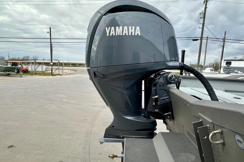 Slide: The Image of 2026 SeaArk 2472 CUB with Yamaha outboard motor in a parking lot setting. - 8