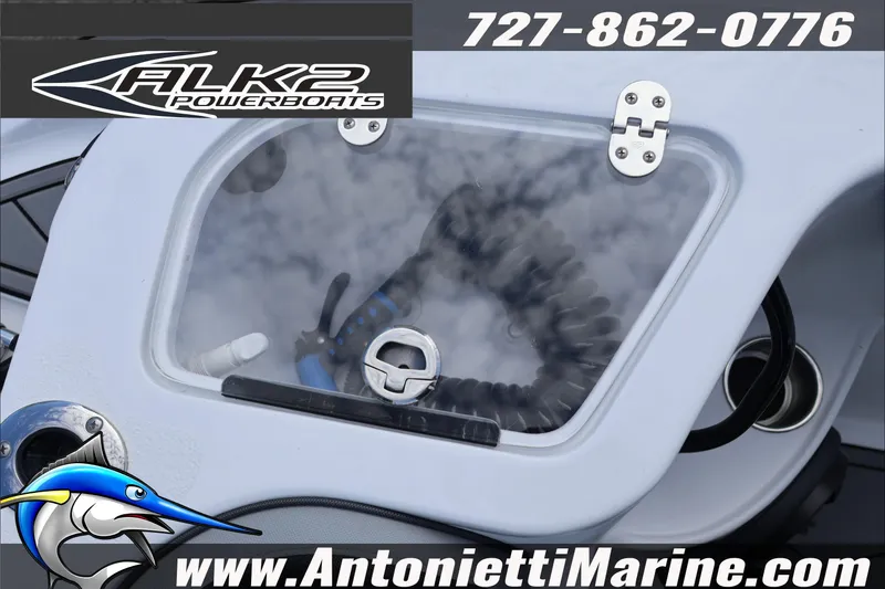 Slide: The Image of 2026 ALK2 Powerboats 25 CRXL dashboard with logo and contact details. - 21