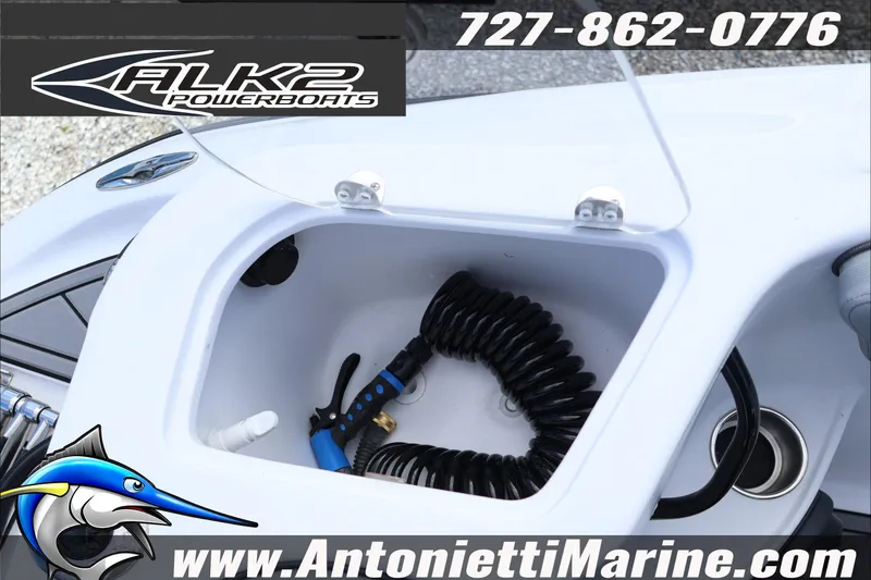 Slide: The Image of 2026 ALK2 Powerboats 25 CRXL with storage compartment and coiled hose. - 22