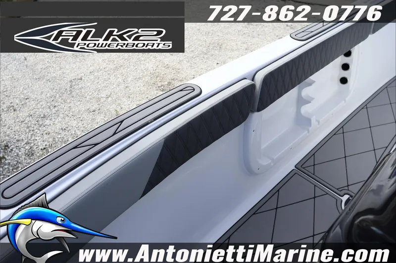 Slide: The Image of 2026 ALK2 Powerboats 25 CRXL interior with sleek design and marine branding. - 23