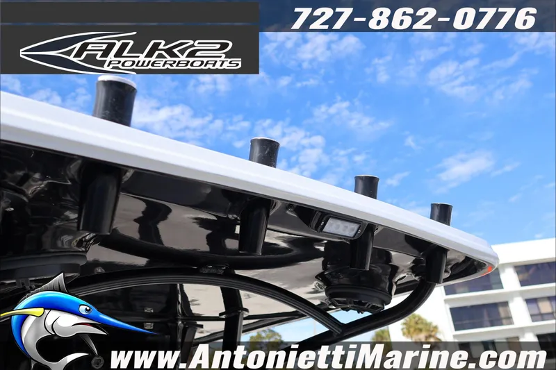 Slide: The Image of 2026 ALK2 Powerboats 25 CRXL with rod holders, blue sky background, Antonietti Marine branding. - 31