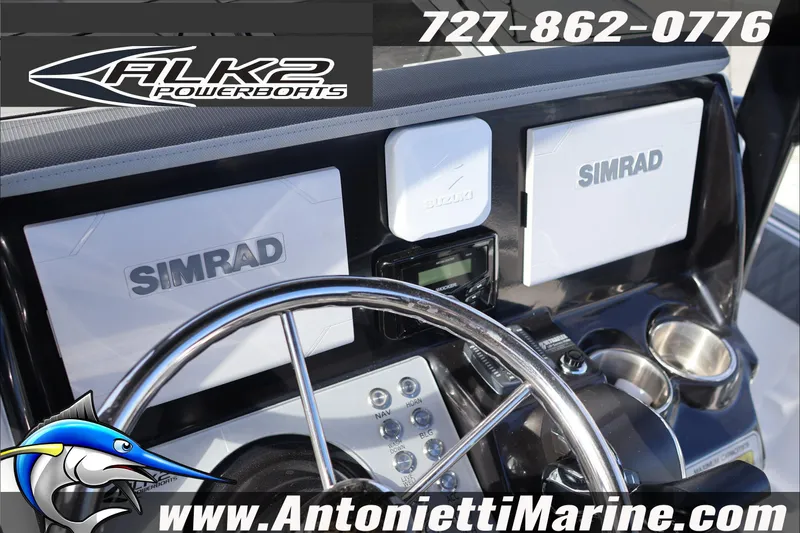 Slide: The Image of Control panel of 2026 ALK2 Powerboats 25 CRXL with Simrad displays and steering wheel. - 9