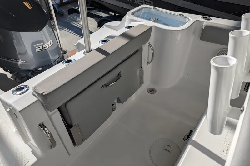 Slide: The Image of 2026 Wellcraft 223 Fisherman boat interior with Yamaha 250 engine, rod holders, and seating. - 11