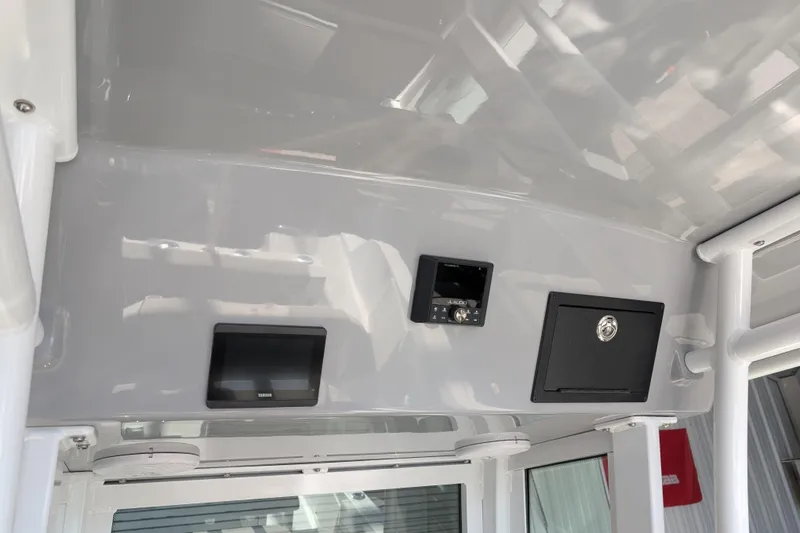 Slide: The Image of Interior view of 2026 Wellcraft 223 Fisherman boat dashboard with electronic controls. - 5