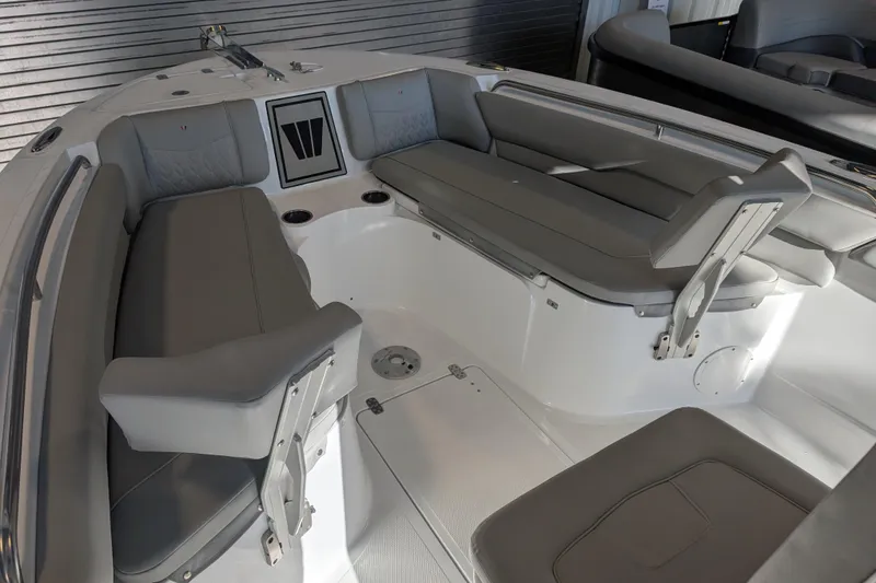 Slide: The Image of 2026 Wellcraft 223 Fisherman boat interior with gray seating and modern design. - 7