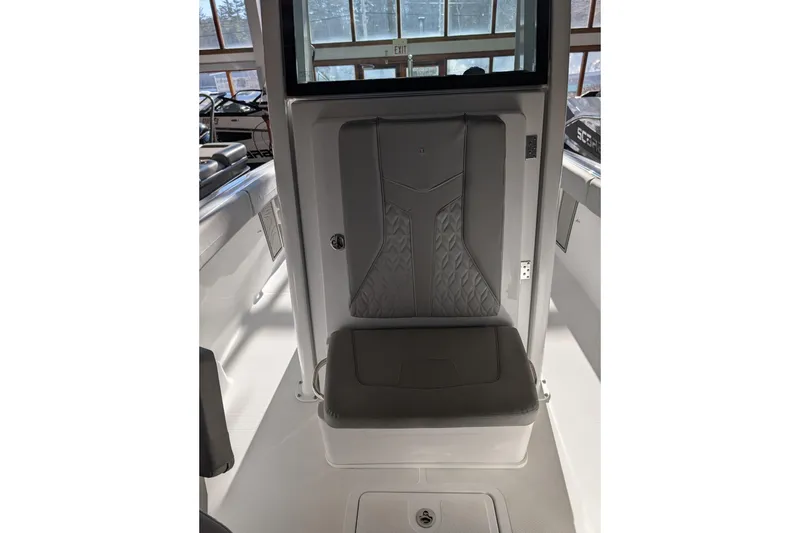 Slide: The Image of 2026 Wellcraft 223 Fisherman boat interior with cushioned seating and modern design. - 8