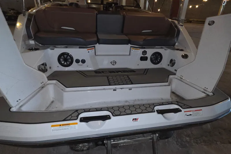 Slide: The Image of 2018 Scarab 255 boat interior with seating and storage compartments. - 5