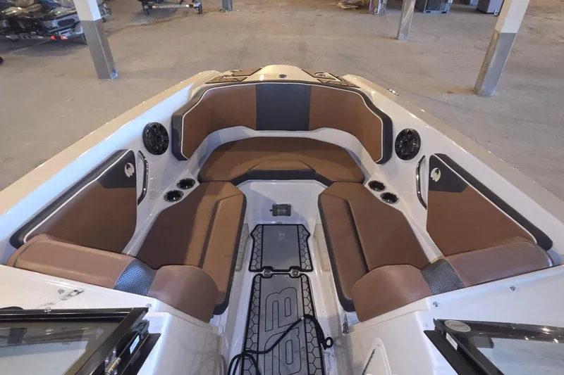 Slide: The Image of Interior of 2018 Scarab 255 boat with brown seating and modern design. - 8