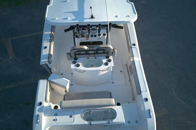 Slide: The Image of 2021 Sea Pro 259 Center Console boat interior, aerial view, showcasing seating and console layout. - 16