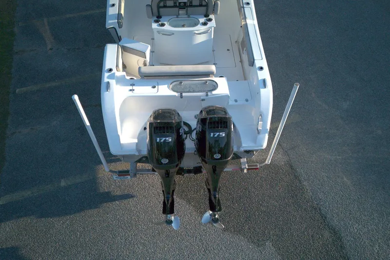 Slide: The Image of 2021 Sea Pro 259 Center Console boat with dual 175 horsepower engines, aerial view. - 2