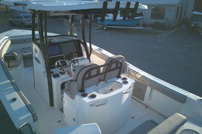 Slide: The Image of 2021 Sea Pro 259 Center Console boat interior with helm and seating area. - 3