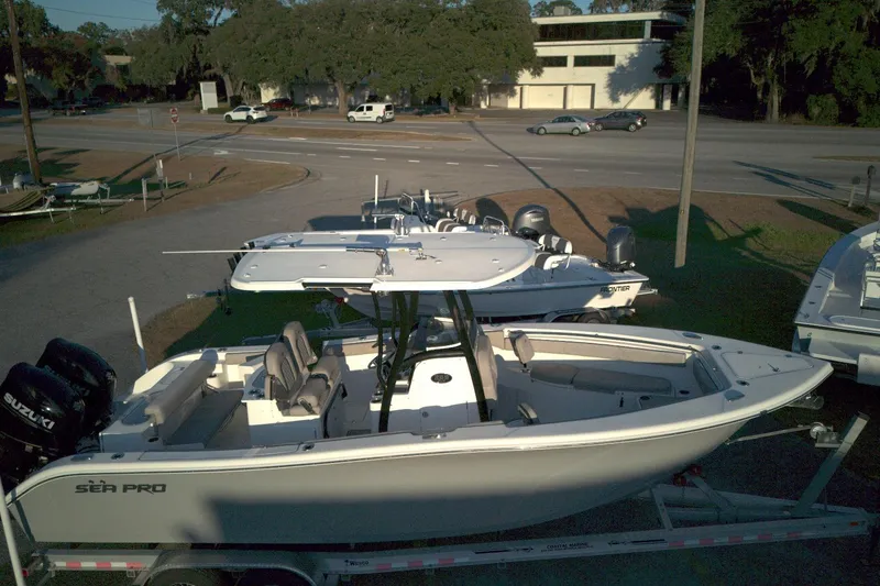Slide: The Image of 2021 Sea Pro 259 Center Console boat on trailer, parked outdoors. - 4