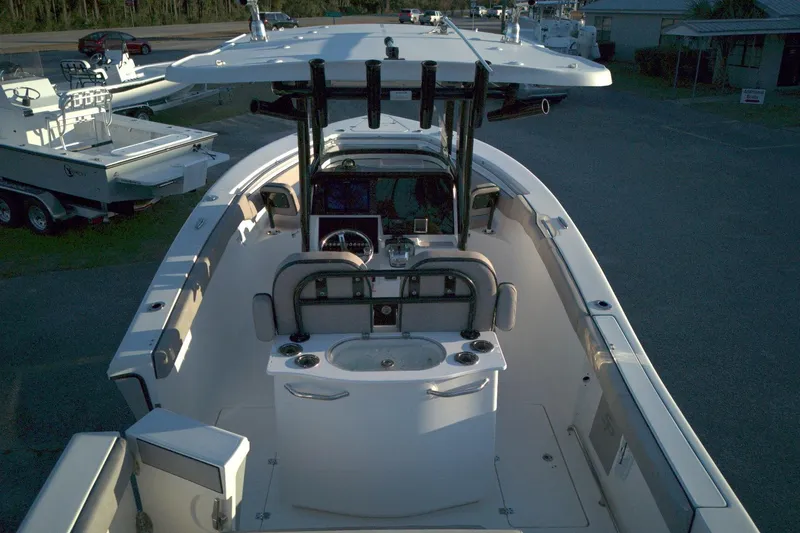 Slide: The Image of 2021 Sea Pro 259 Center Console boat, top view, showcasing helm and seating area. - 5