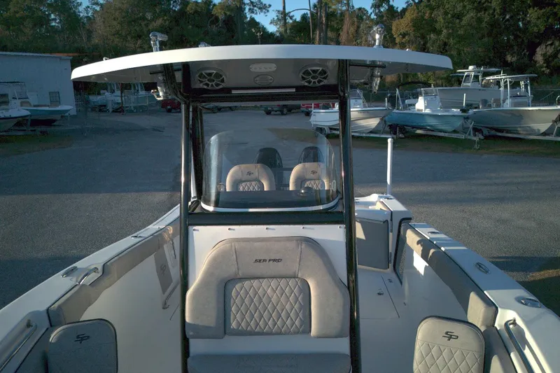 Slide: The Image of 2021 Sea Pro 259 Center Console boat with seating, parked in a marina. - 7