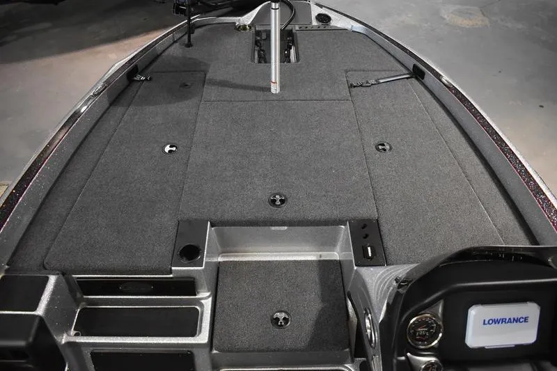 Slide: The Image of 2026 Triton 18 TrX boat interior with Lowrance electronics and spacious deck layout. - 11