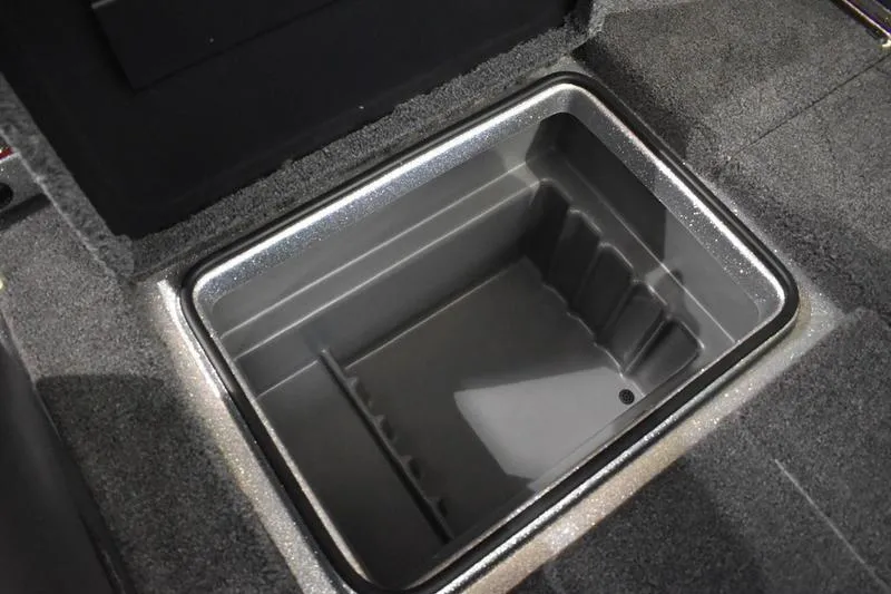 Slide: The Image of Open storage compartment in 2026 Triton 18 TrX boat, featuring a sleek, durable design. - 14