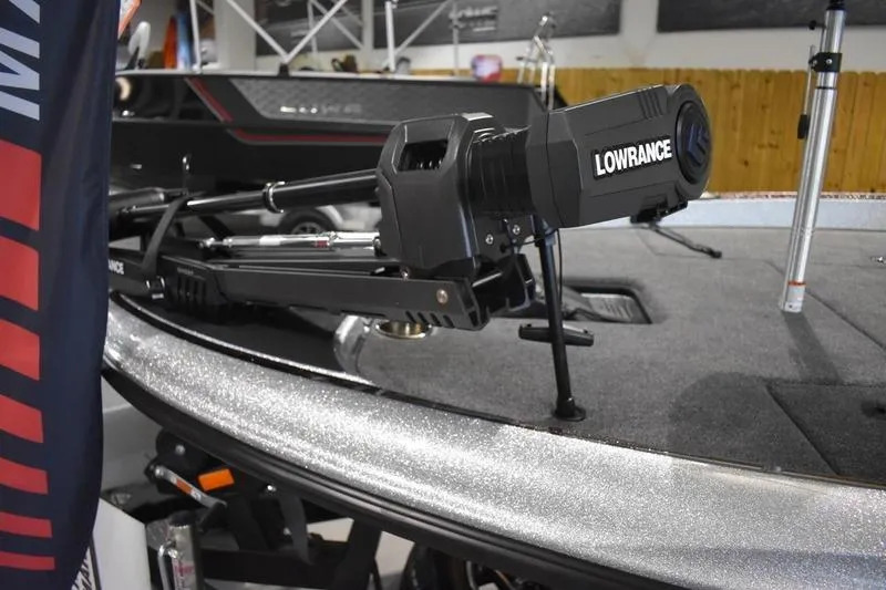 Slide: The Image of 2026 Triton 18 TrX boat with Lowrance equipment on deck. - 2