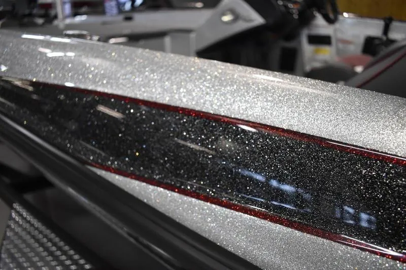 Slide: The Image of 2026 Triton 18 TrX boat with sparkling metallic finish and sleek design. - 3