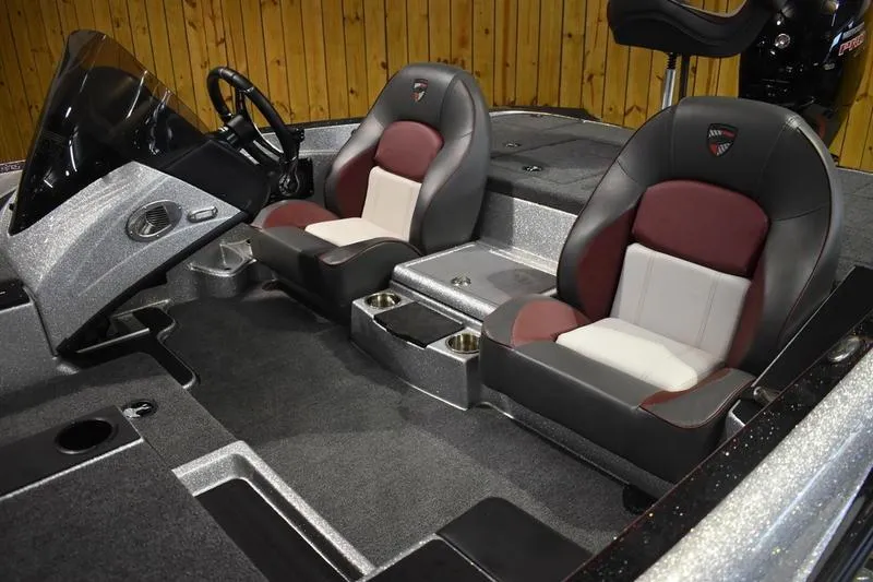 Slide: The Image of 2026 Triton 18 TrX boat interior with dual seats and steering console. - 6