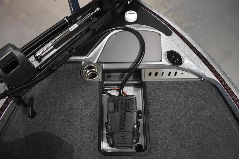 Slide: The Image of Triton 18 TrX 2026 boat deck with Lowrance electronics and trolling motor setup. - 7