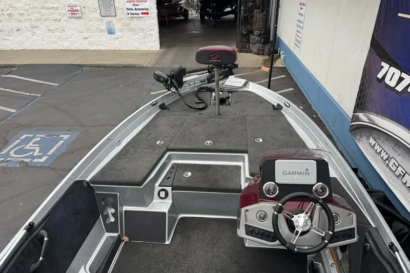 Slide: The Image of 2017 Ranger Z175 boat with Garmin system, parked near a service center. - 20