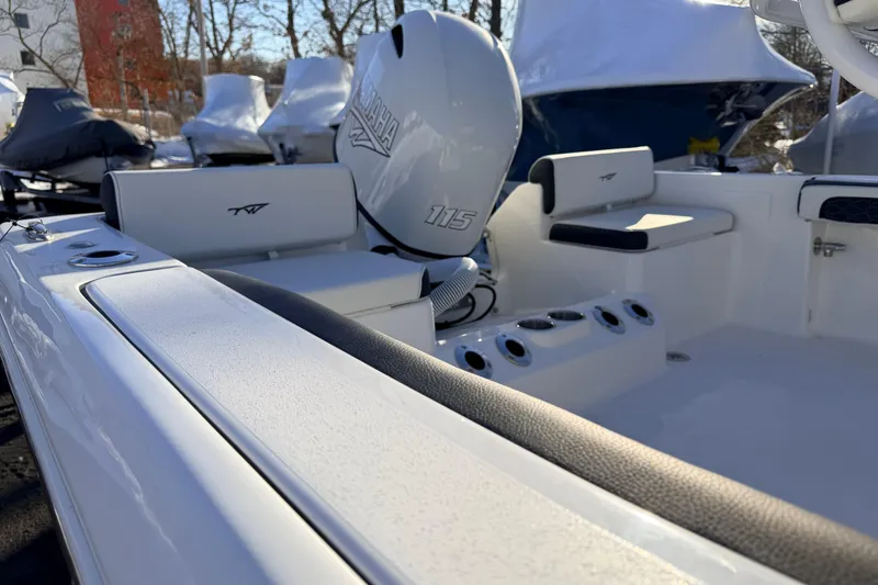 Slide: The Image of 2026 Tidewater 198 CC Adventure boat interior with Yamaha 115 engine, showcasing seating and controls. - 10