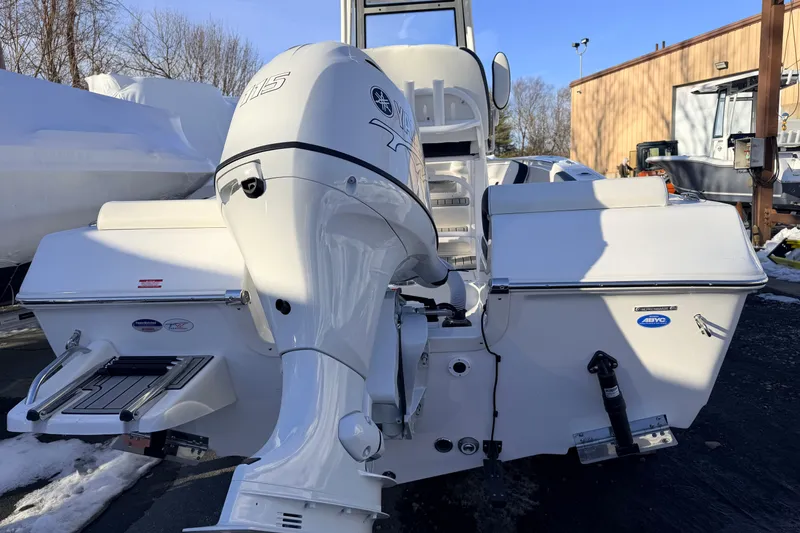 Slide: The Image of 2026 Tidewater 198 CC Adventure boat with powerful outboard motor in a sunny outdoor setting. - 12