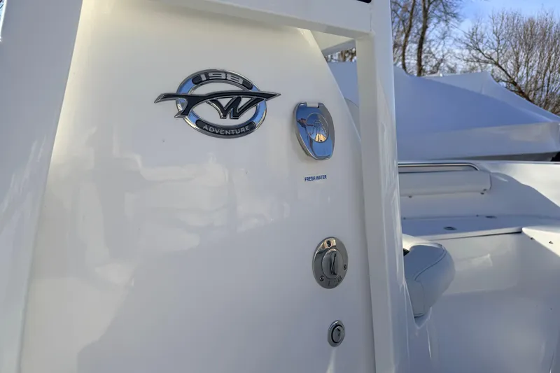 Slide: The Image of 2026 Tidewater 198 CC Adventure boat interior with logo and fresh water access. - 14