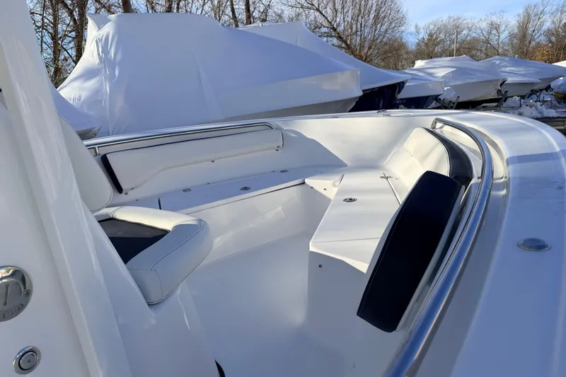 Slide: The Image of 2026 Tidewater 198 CC Adventure boat interior with white seating and stainless steel railings. - 15