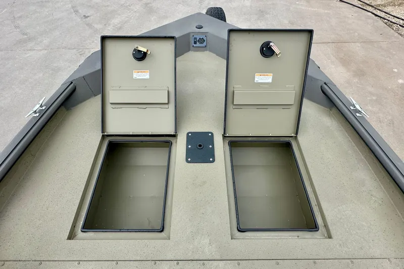 Slide: The Image of 2026 SeaArk Shadow 17 boat with open storage compartments on deck. - 12