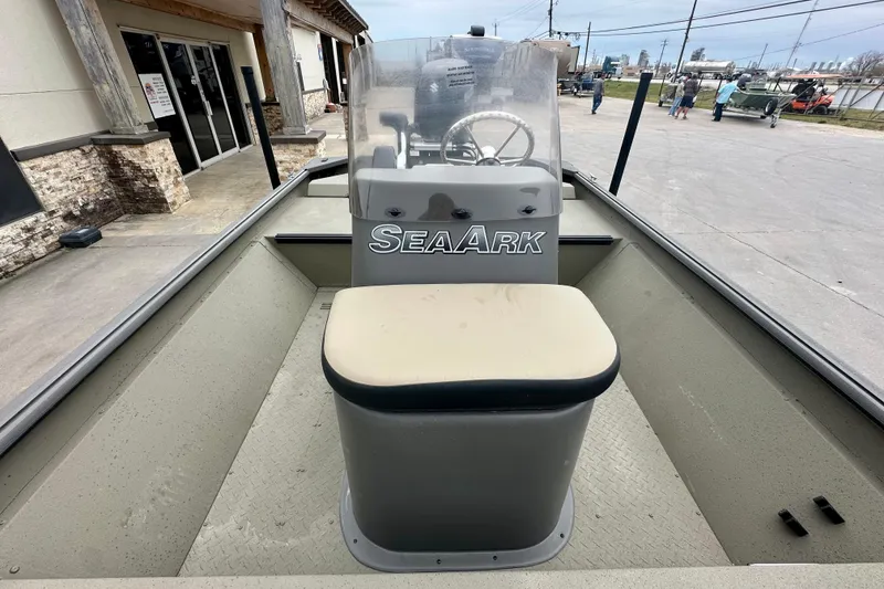 Slide: The Image of 2026 SeaArk Shadow 17 boat interior with steering console and seating. - 13